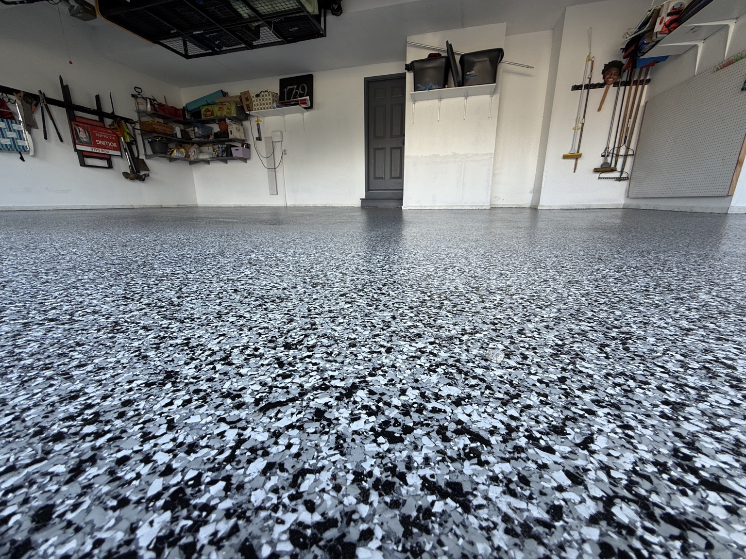 Finished black, white and gray flake garage floor installed by G2G