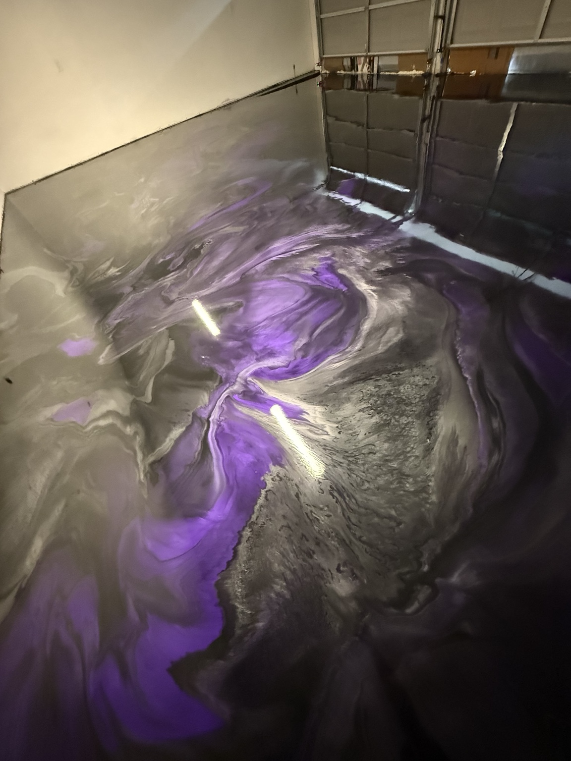 Purple and silver metallic floor with flowing pattern