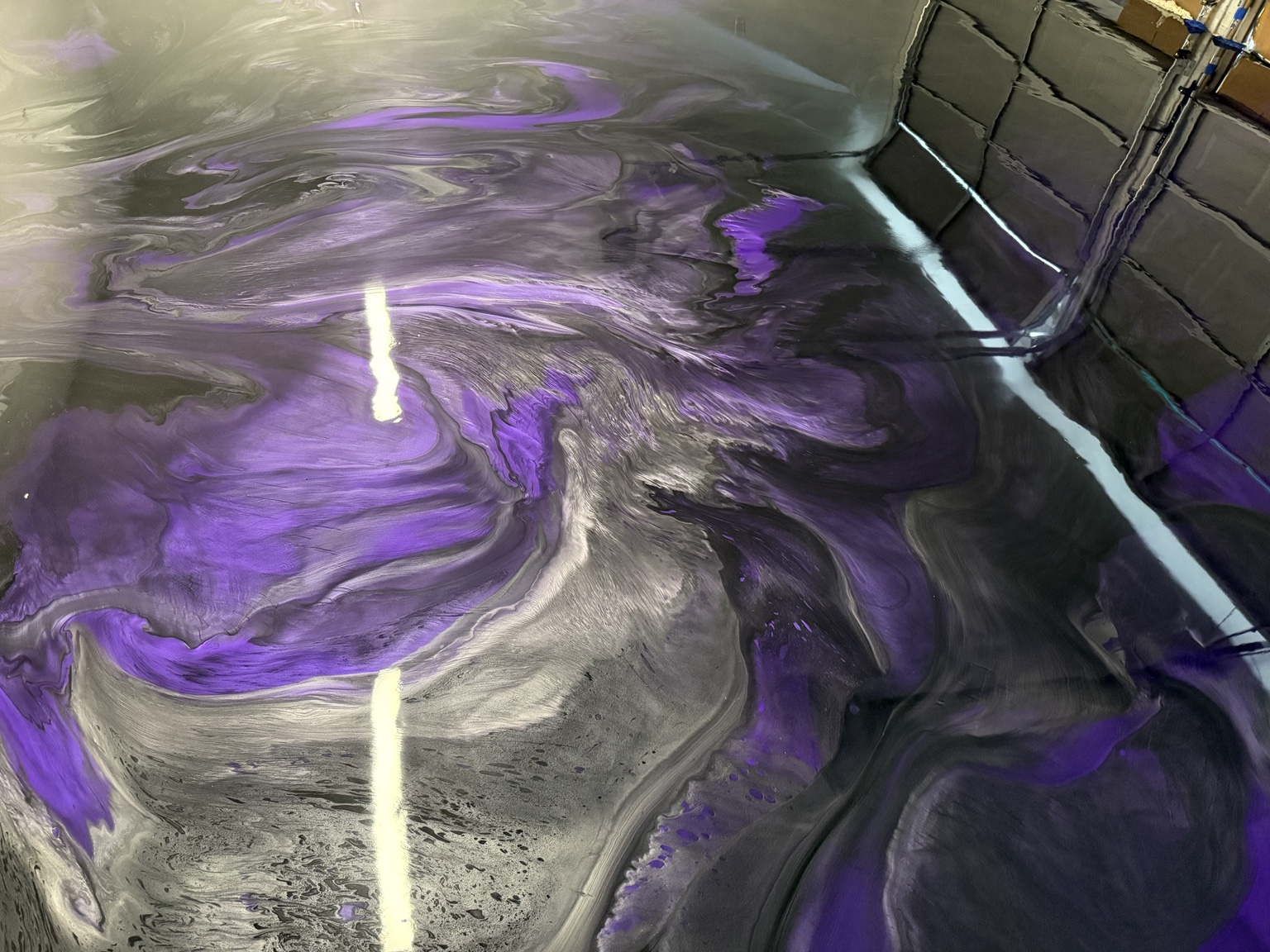 Purple and silver metallic floor with flowing color pattern